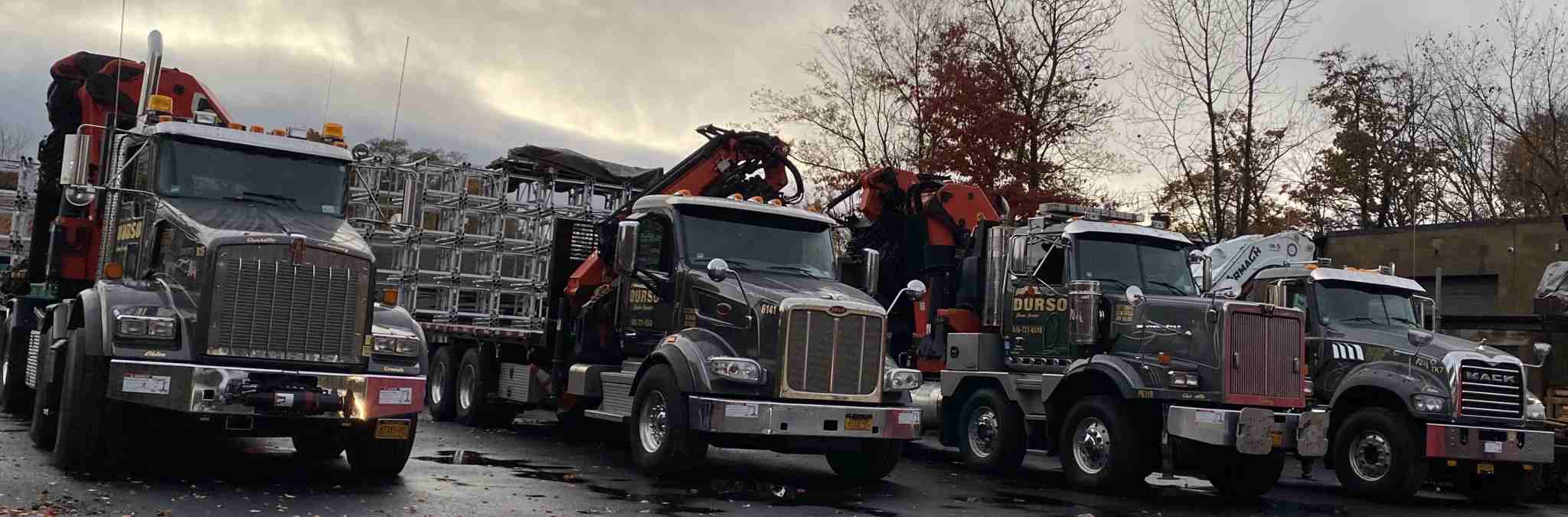 durso knuckleboom trucks parked in yard